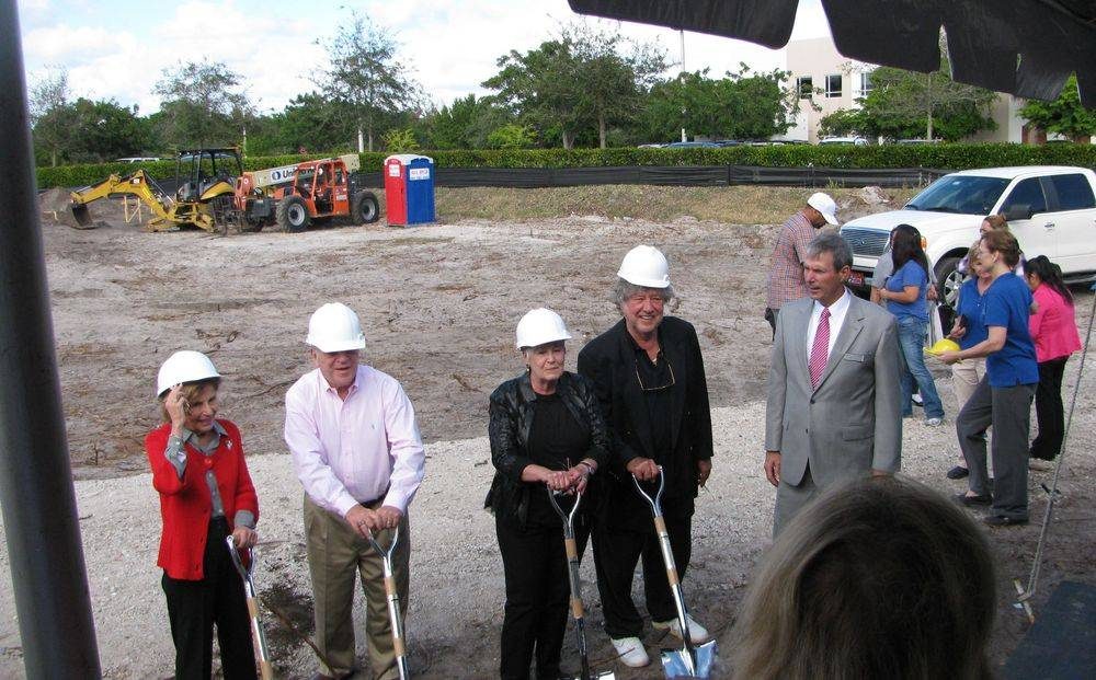 A groundbreaking ceremony, hard hats and shovels