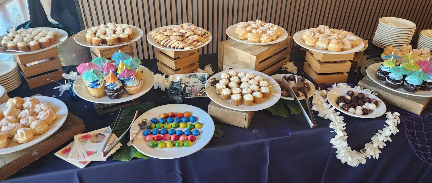 A dessert table laid out for a celebration at Aloha