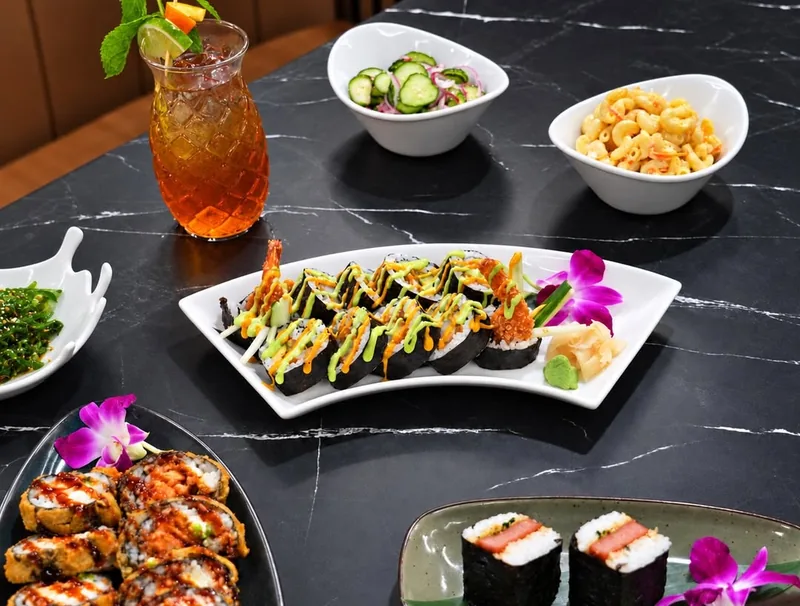 Aloha plates: Spam musubi, sushi rolls, macaroni salad and a cocktail